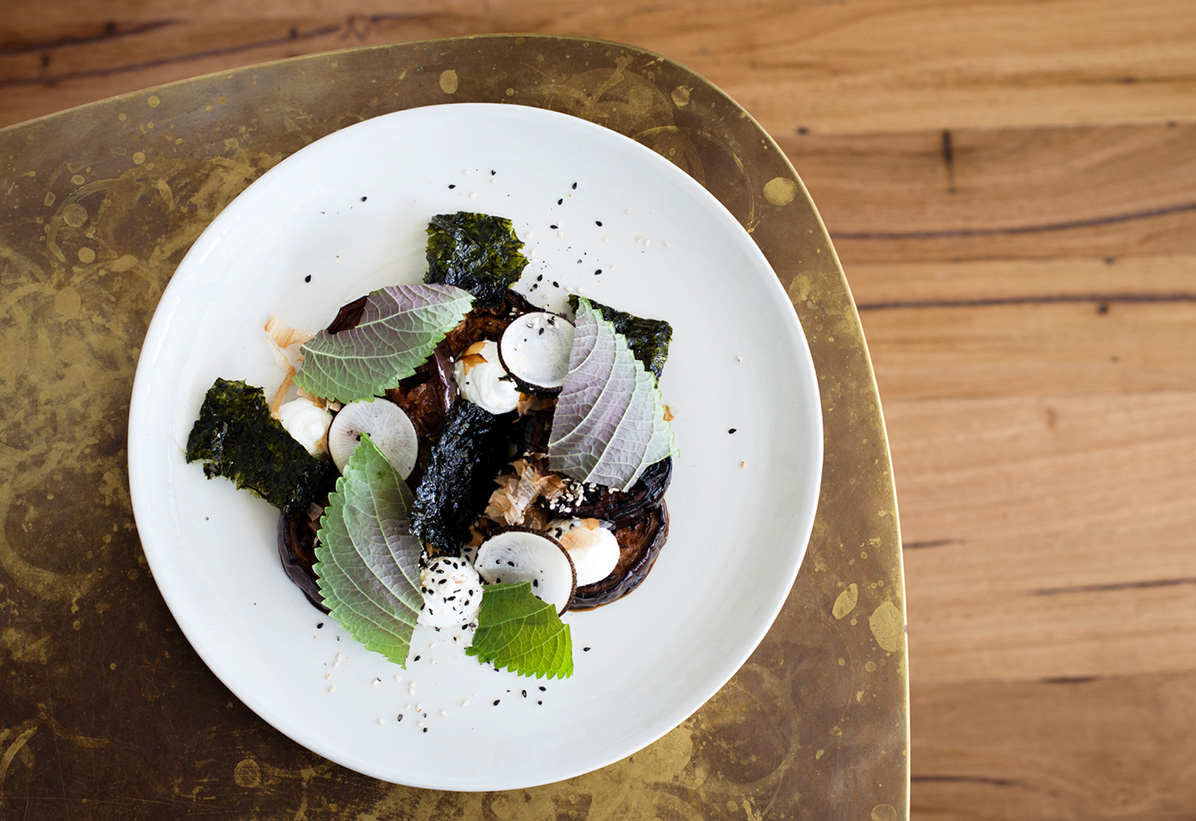 Eggplant, smoked goat’s curd, katsuobushi and sesame shot by Lee Grant. 