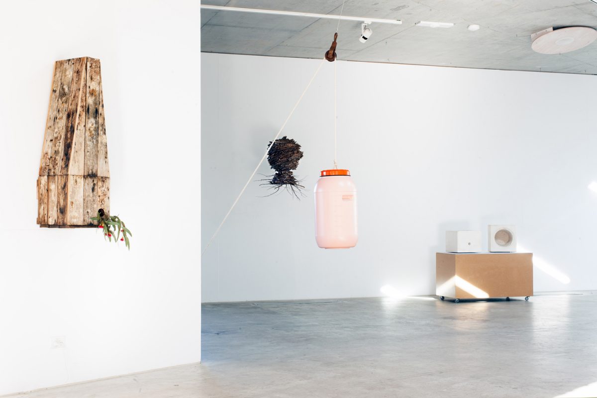 '60L Drum' by Field Experiments. Shot by Charlie White.<br />
Plastic, rope, rusted-steel pulley.