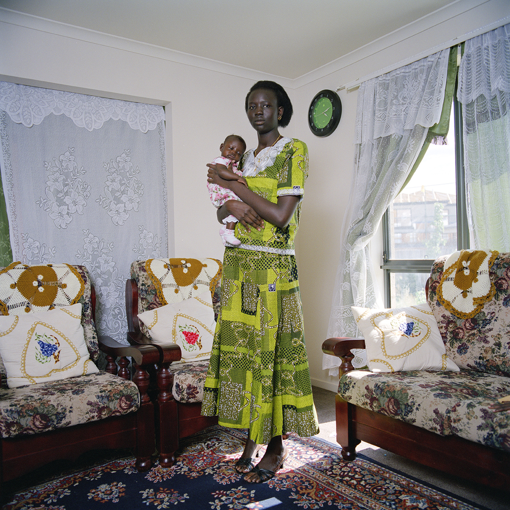 Anna holds her baby Amach from Lee's series 'Sudanese Portraits from Suburbia'
