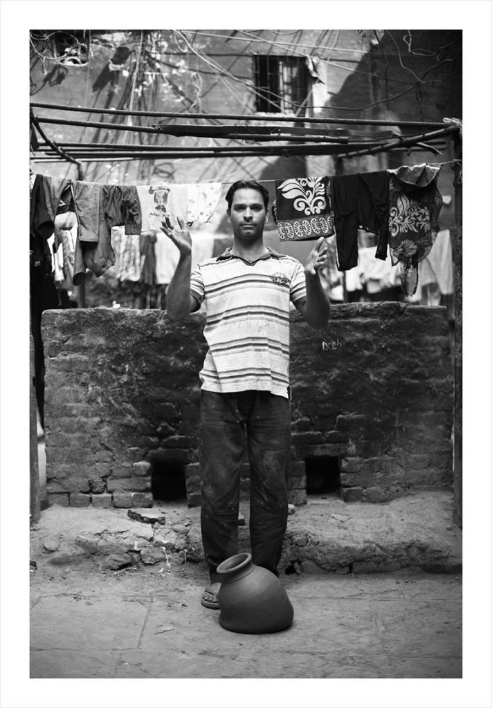 Portrait of Abbas Galwani for 'Dropping A Kumbhar Wala Matka' by Trent Jansen. Shot by Trent Jansen. An homage to Ai Wei Wei’s controversial work, ‘Dropping a Han Dynasty Urn’, 1995.